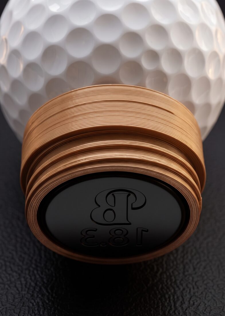 Close-up of the Dimple¹ stamp's contact face, with a mirrored B and 18.3 design framed by the threaded PLA housing